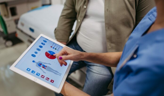 Close,Up,Of,Female,Doctor,Consulting,With,Overweight,Patient,,Discussing