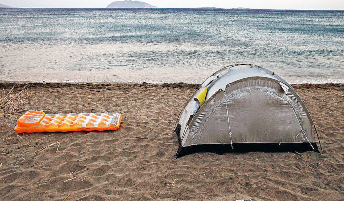 Tourist,Tent,Camping,On,The,Beach,Of,Roukounas,In,Anafi
